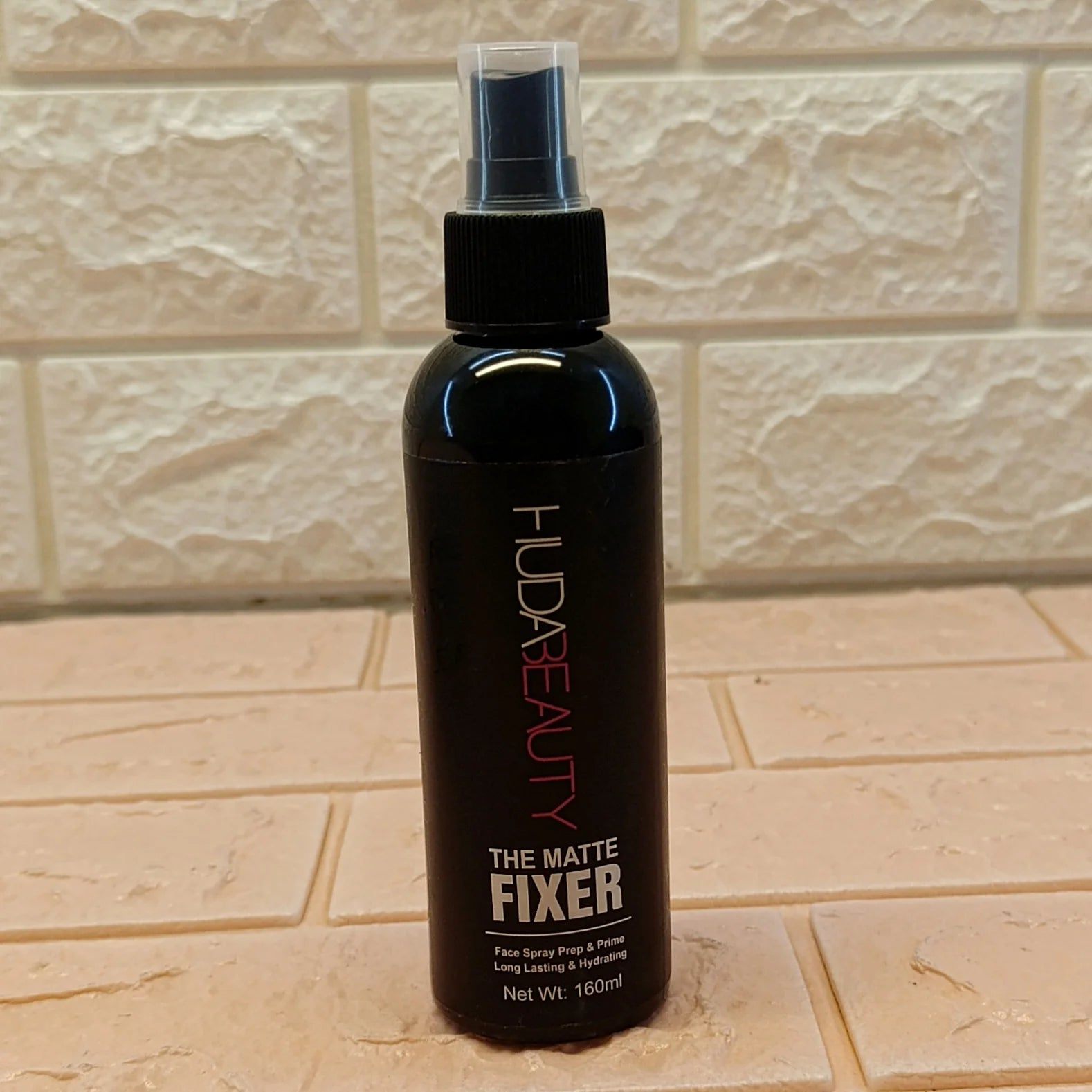 Huda Beauty’s Makeup Setting Spray & Fixer